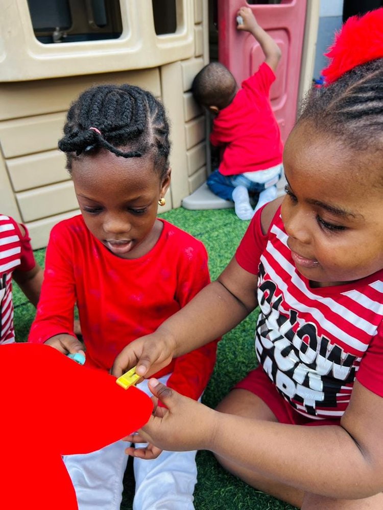 Pupils celebrating together at Flourish Playhouse