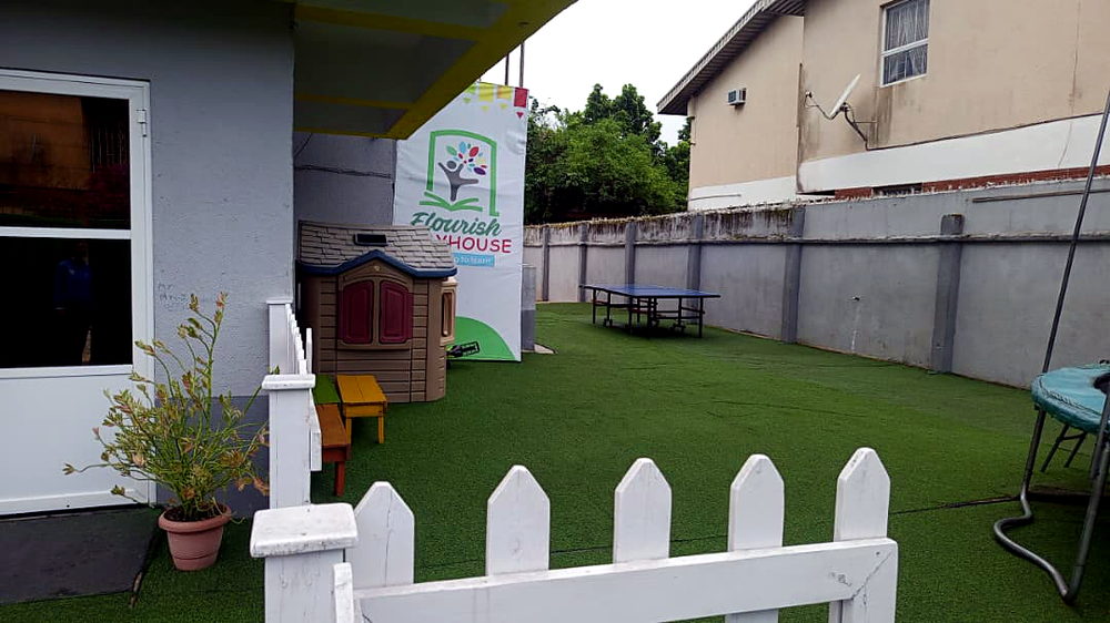 Playhouse and benches corner at Flourish Playhouse